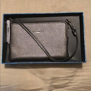 Brand new gunmetal colored Coach wristlet